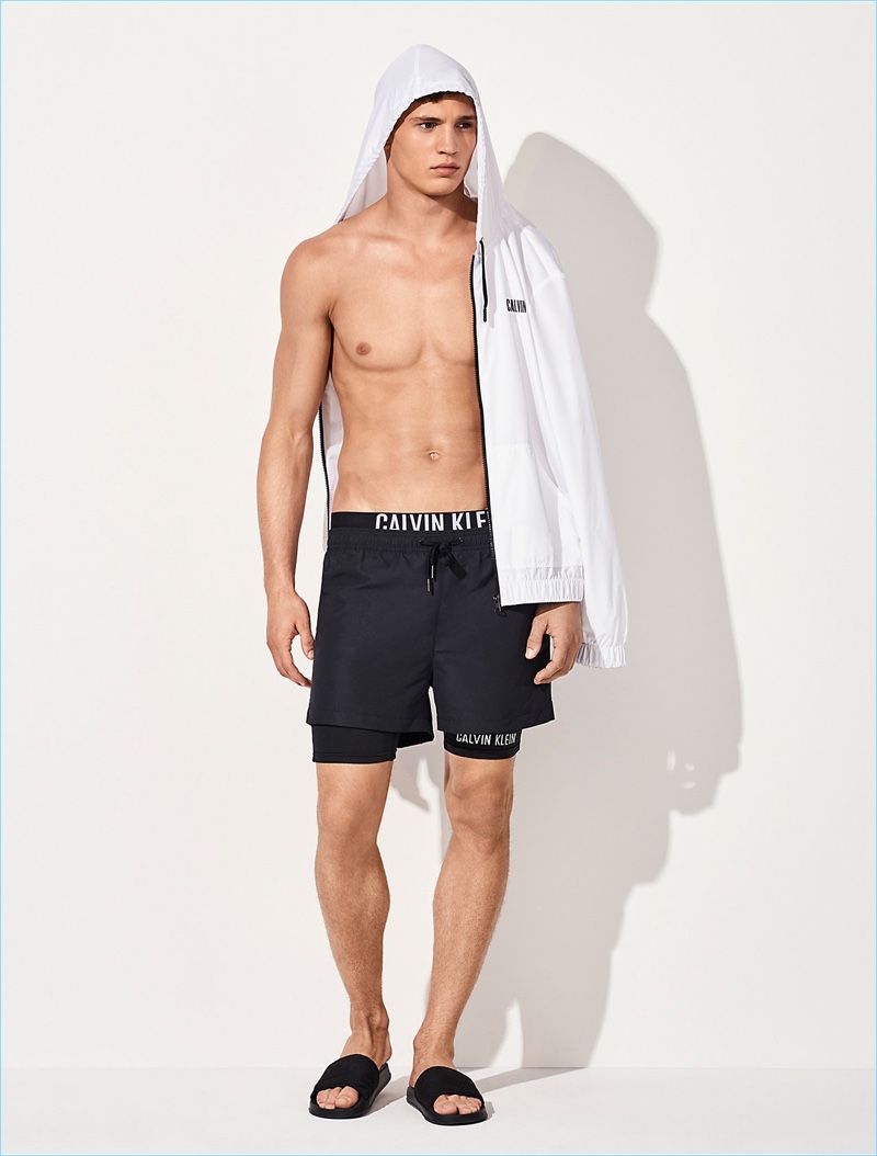 Going sporty, Julian Schneyder wears Calvin Klein Intense Power combo board shorts $70 with a power windbreaker $80.