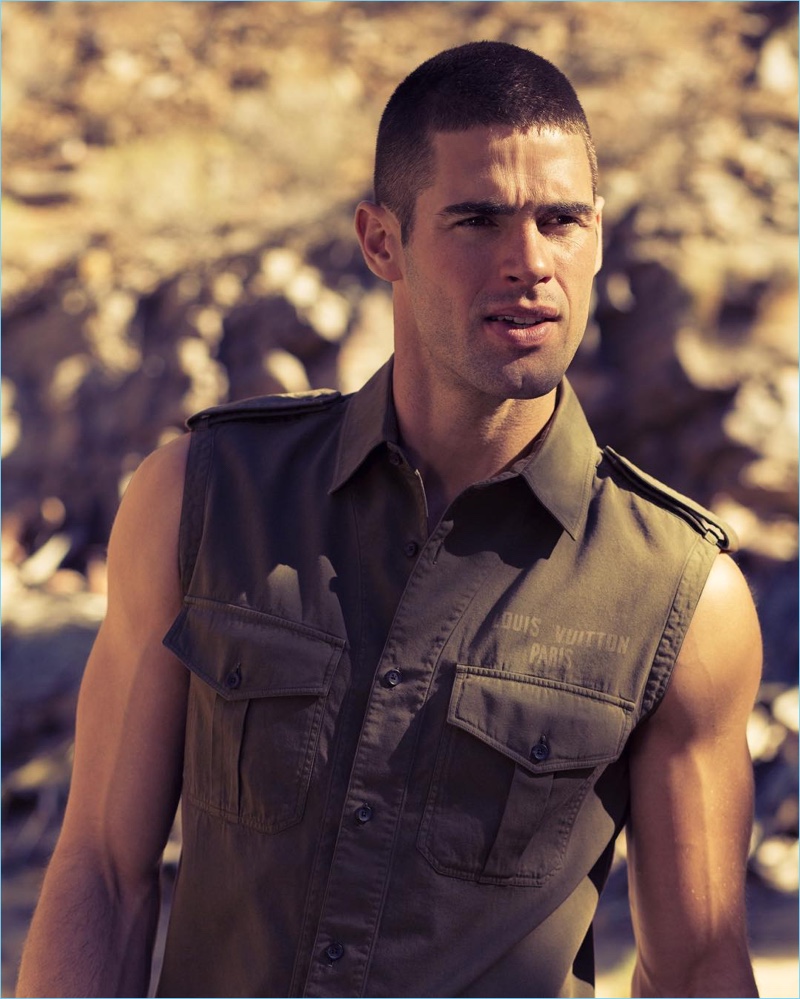 Tapping into the military trend, Chad White wears a sleeveless shirt with epaulets from Louis Vuitton.