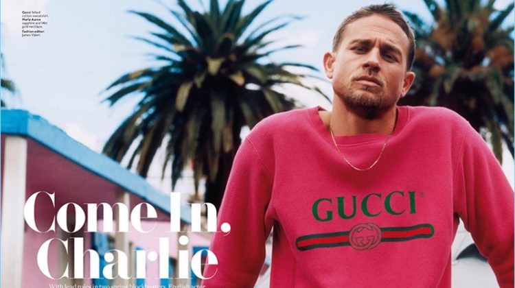 Charlie Hunnam wears a red Gucci sweatshirt with a Marla Aaron necklace.