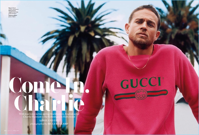 Charlie Hunnam wears a red Gucci sweatshirt with a Marla Aaron necklace.