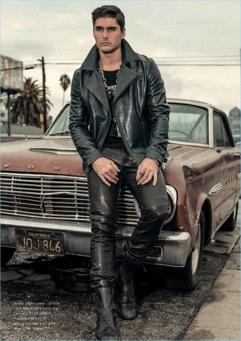 Posing against an old Ford car, Charlie Matthews stars in an editorial for Risbel magazine.