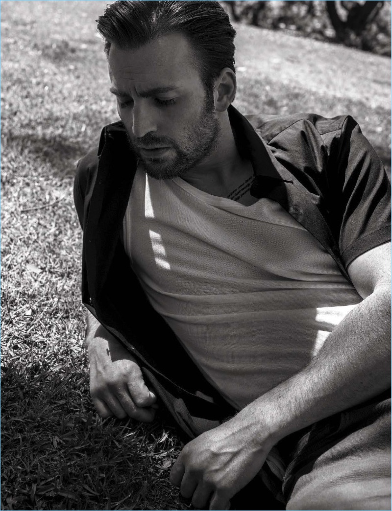 Starring in a photo shoot for L'Uomo Vogue, Chris Evans wears a Theory shirt with J Brand pants.