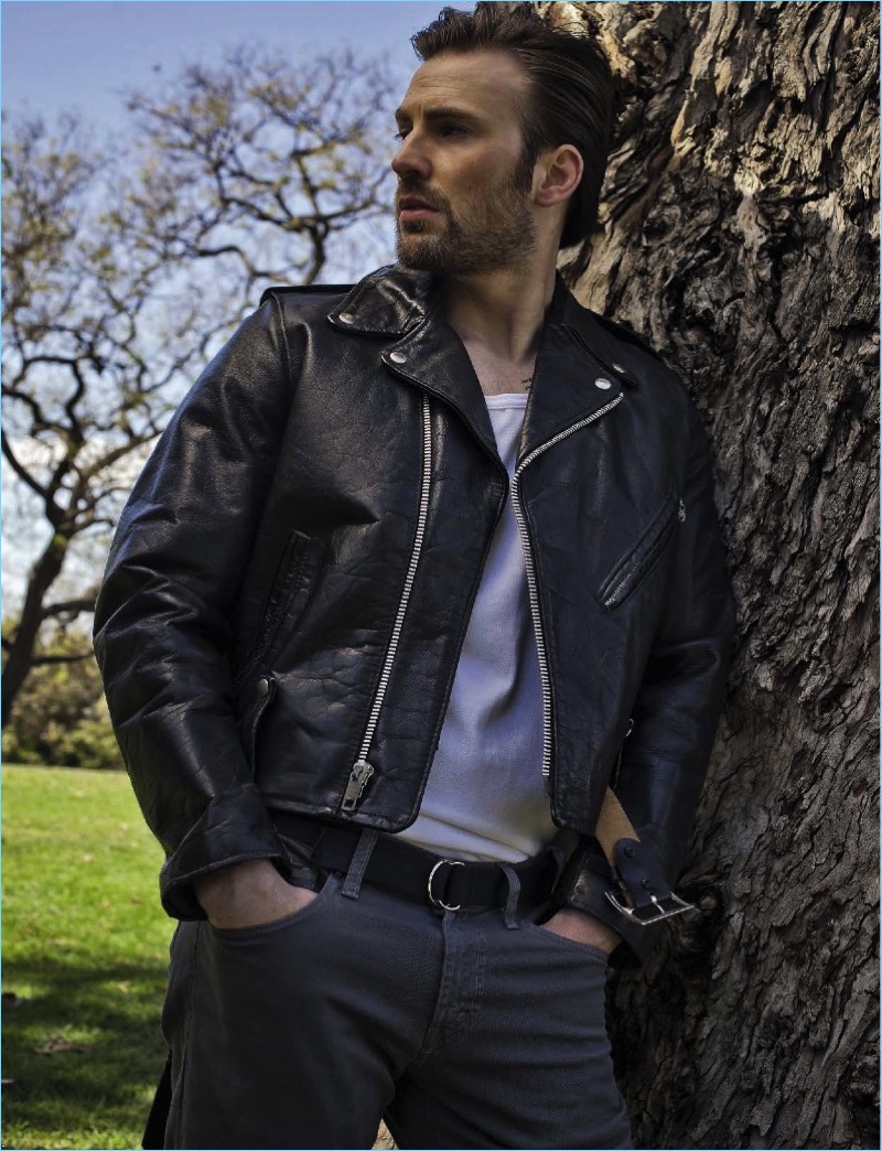 A cool vision, Chris Evans wears a leather biker jacket by What Goes Around Comes Around with J Brand pants.