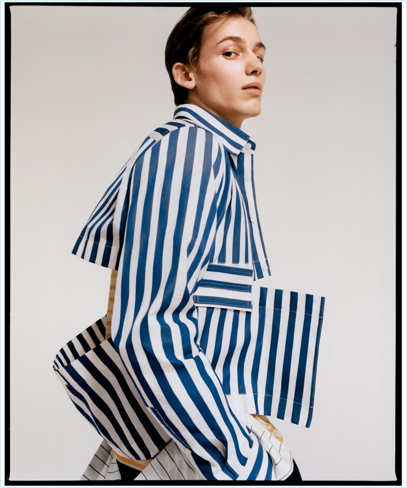 Appearing in a photo shoot for T magazine, Christopher Einla wears a striped Marni shirt with a MHL by Margaret Howell t-shirt.