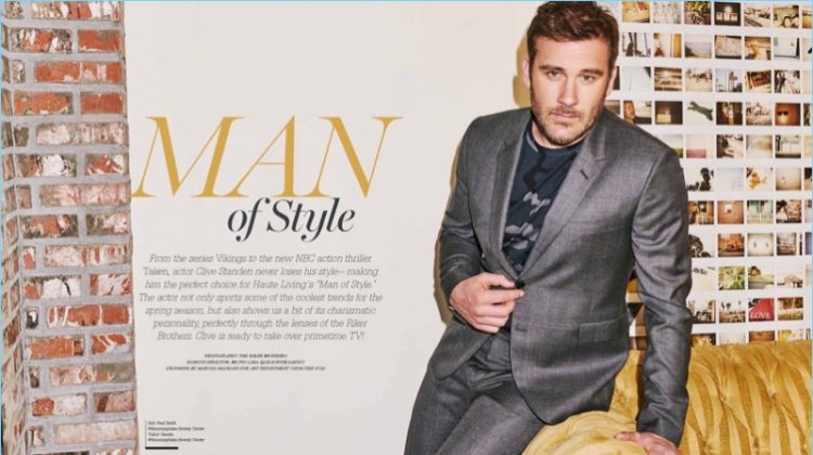 Clive Standen wears a grey Paul Smith suit with a Sandro t-shirt for Haute Living.