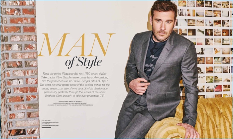 Clive Standen wears a grey Paul Smith suit with a Sandro t-shirt for Haute Living.