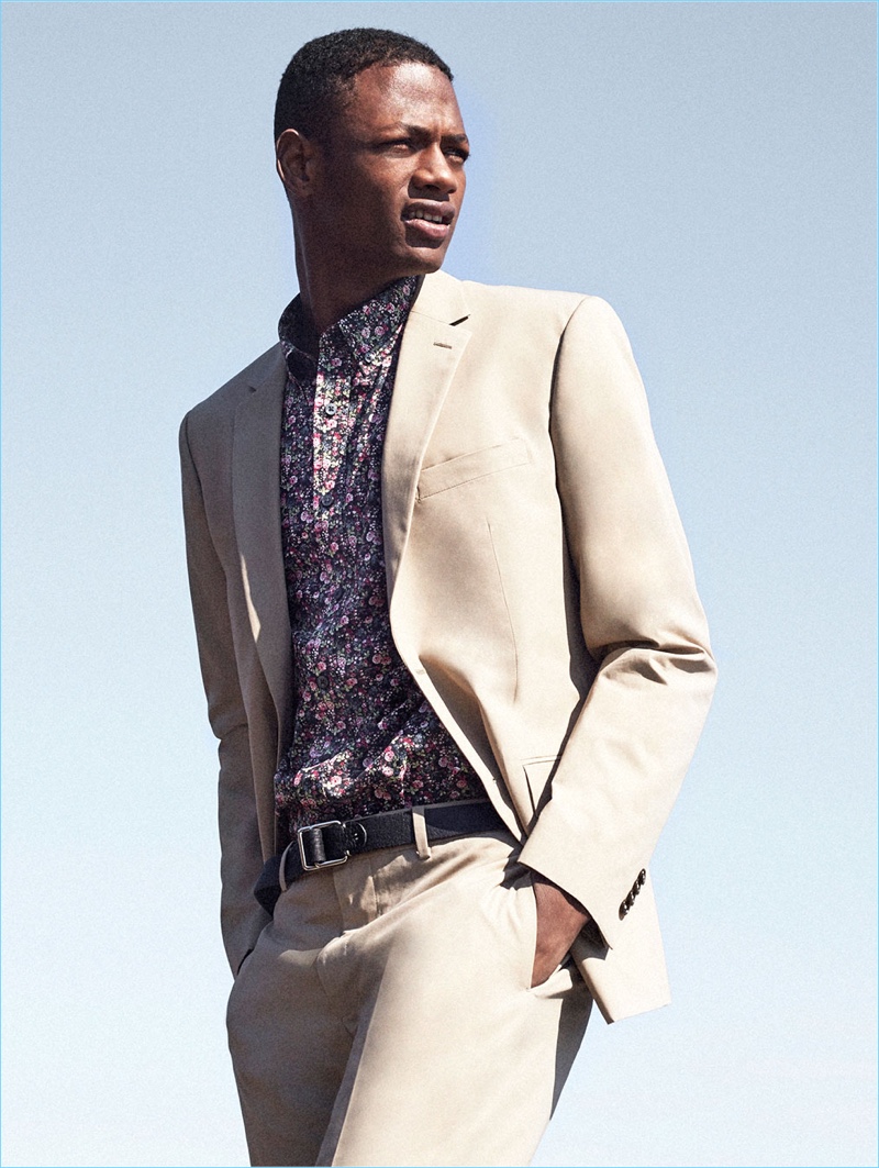 Model Lucas Cristino wears a Club Monaco floral print shirt $98.50, blazer $350, and trousers $198.50.