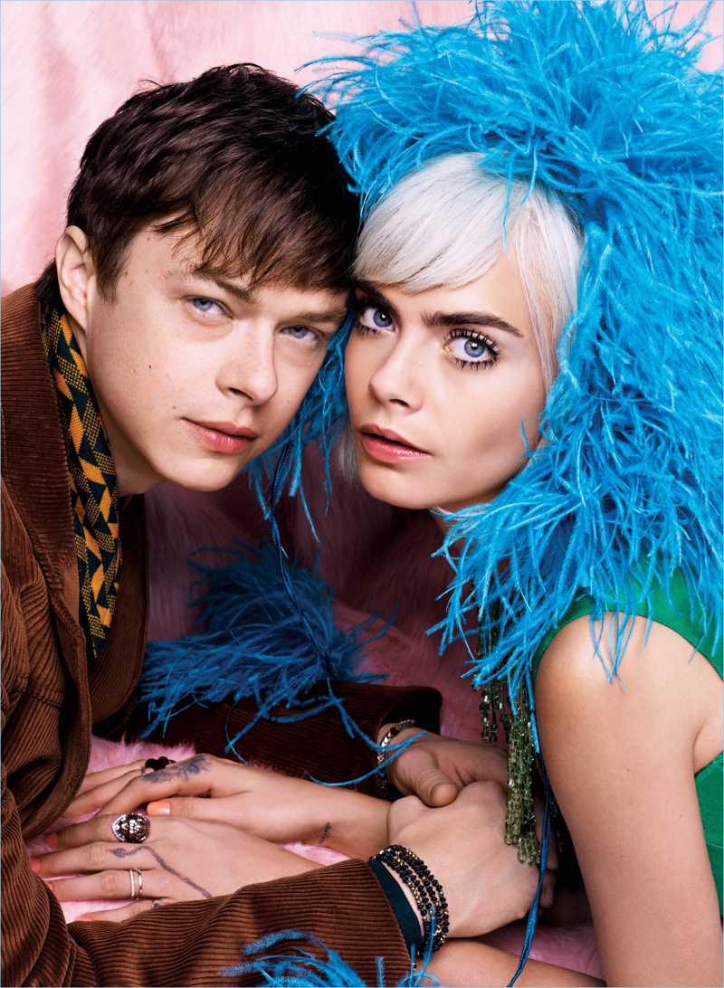 Posing with Cara Delevingne, Dane DeHaan wears Prada.