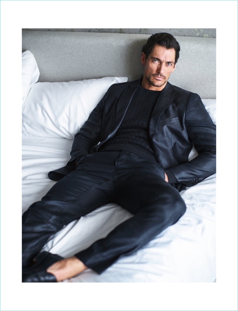 Relaxing in bed, David Gandy wears a tailored look by Massimo Dutti.