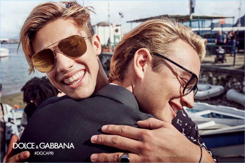 Embracing Brandon Thomas Lee, Cameron Dallas sports Dolce & Gabbana black aviator sunglasses $260.