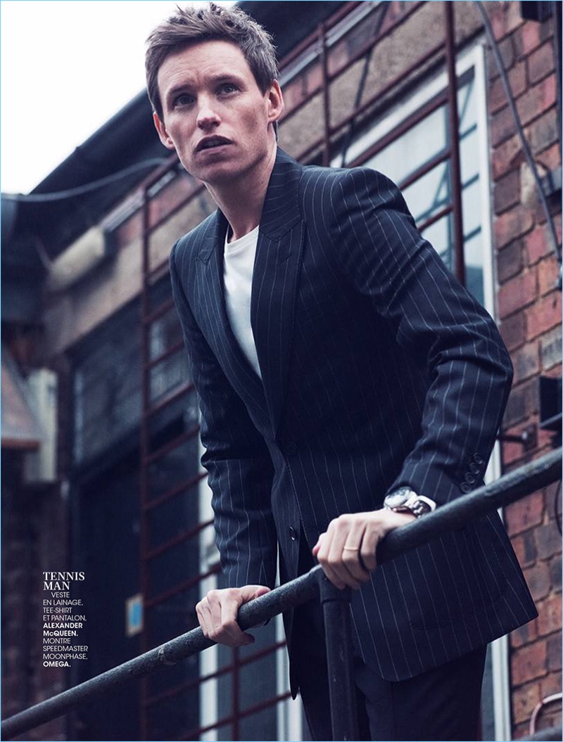Cleaning up in a sartorial number, Eddie Redmayne wears a pinstripe suit and tee by Alexander McQueen with an Omega watch.