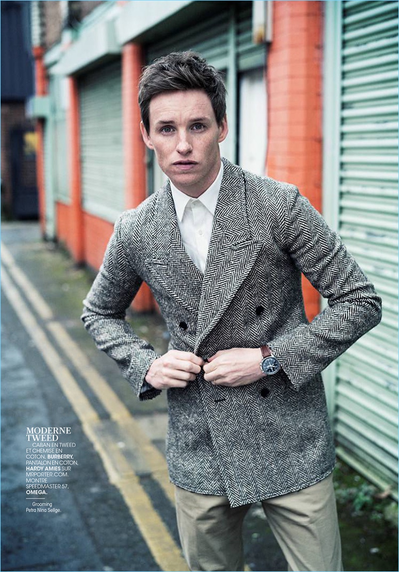 Embracing a smart look, Eddie Redmayne wears a shirt and tweed jacket by Burberry with Hardy Amies trousers and an Omega watch.