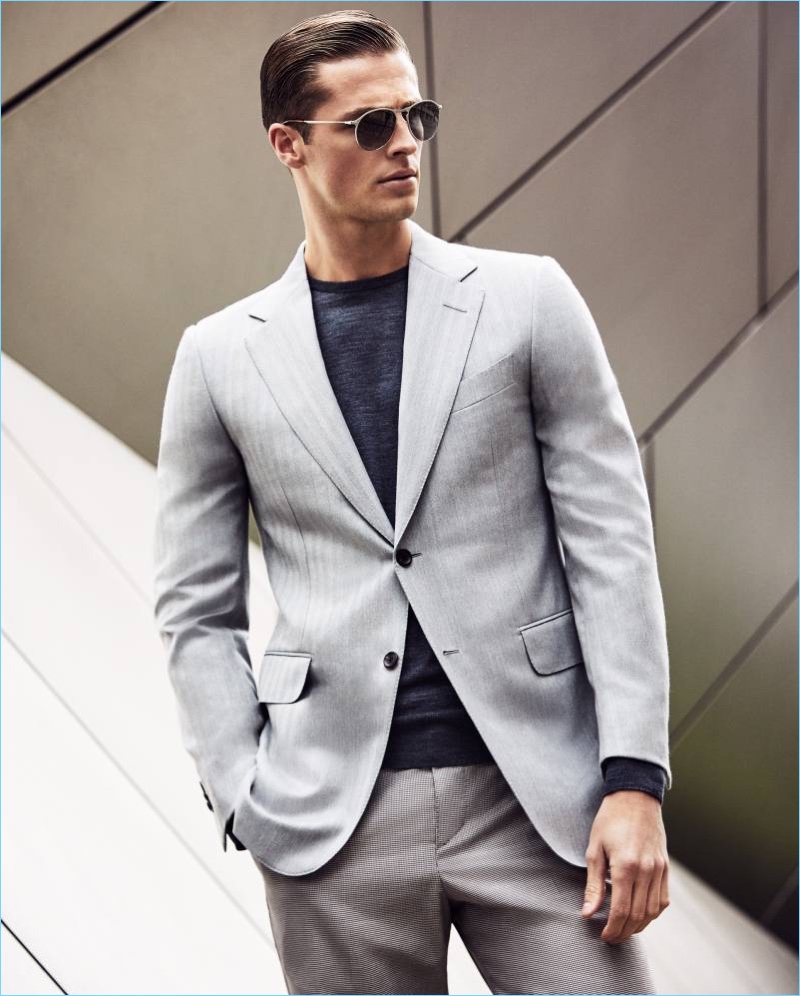 Front and center, Edward Wilding sports a Dunhill suit with a John Smedley wool sweater and Persol sunglasses.
