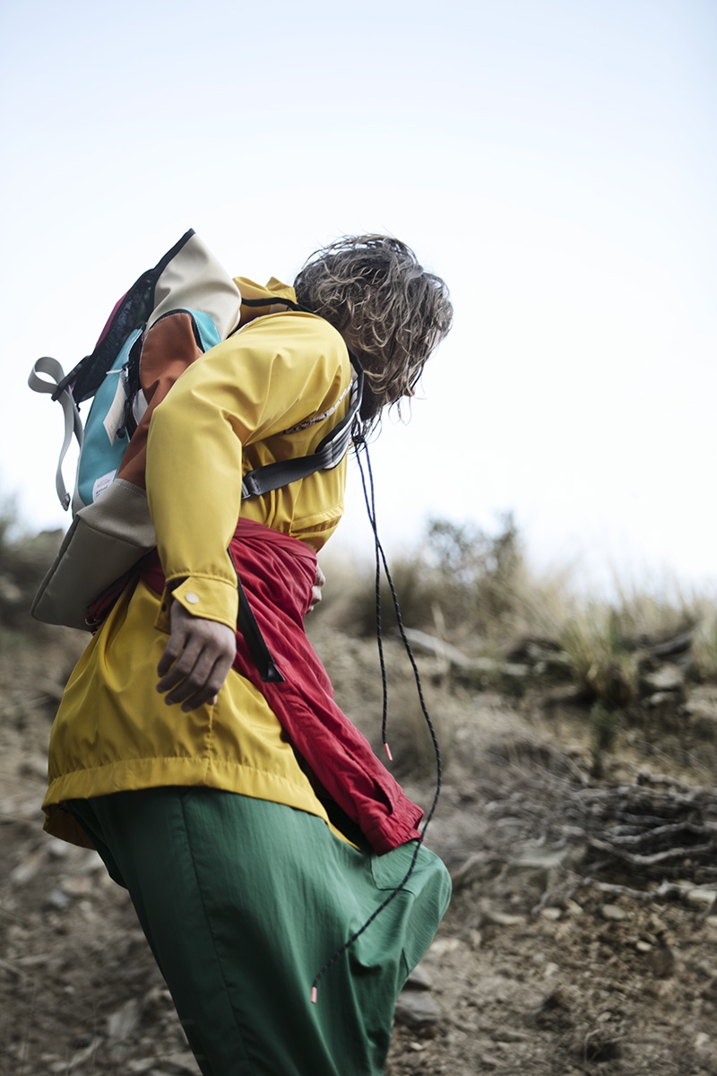 Morgan wears yellow raincoat Unknown Union, backpack Sealand, and vintage trousers.