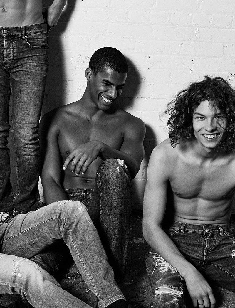 Left to Right: Roman wears distressed denim jeans Dolce & Gabbana. Saul wears jeans AMI. Vitor and Jack wear jeans Dolce & Gabbana.