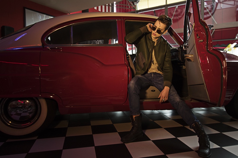 Heiko wears bomber jacket Tom Rebl, t-shirt Avant TOI, jeans Entre Amis, shoes Tom Rebl, and sunglasses Sunday Somewhere.