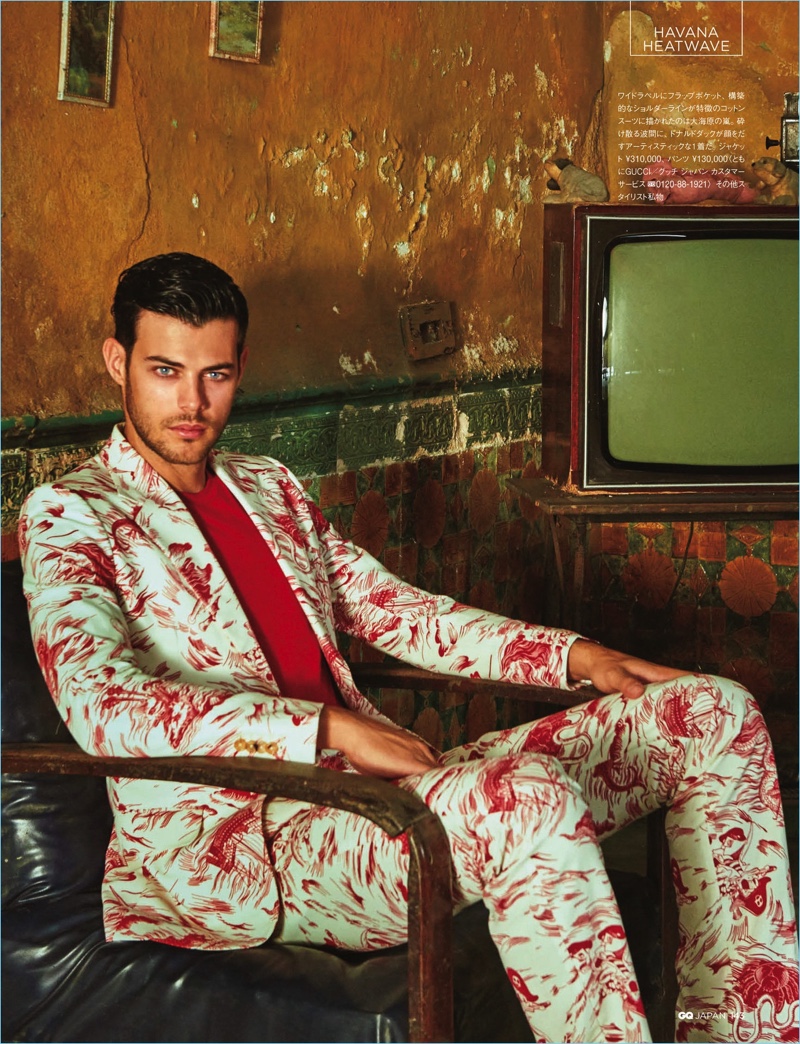 Making a dandy statement, Felix Bujo wears a patterned suit by Gucci.