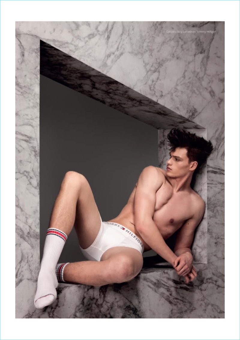 Starring in a photo shoot for Risbel magazine, Filip Hrivnak wears Tommy Hilfiger underwear and tube socks.