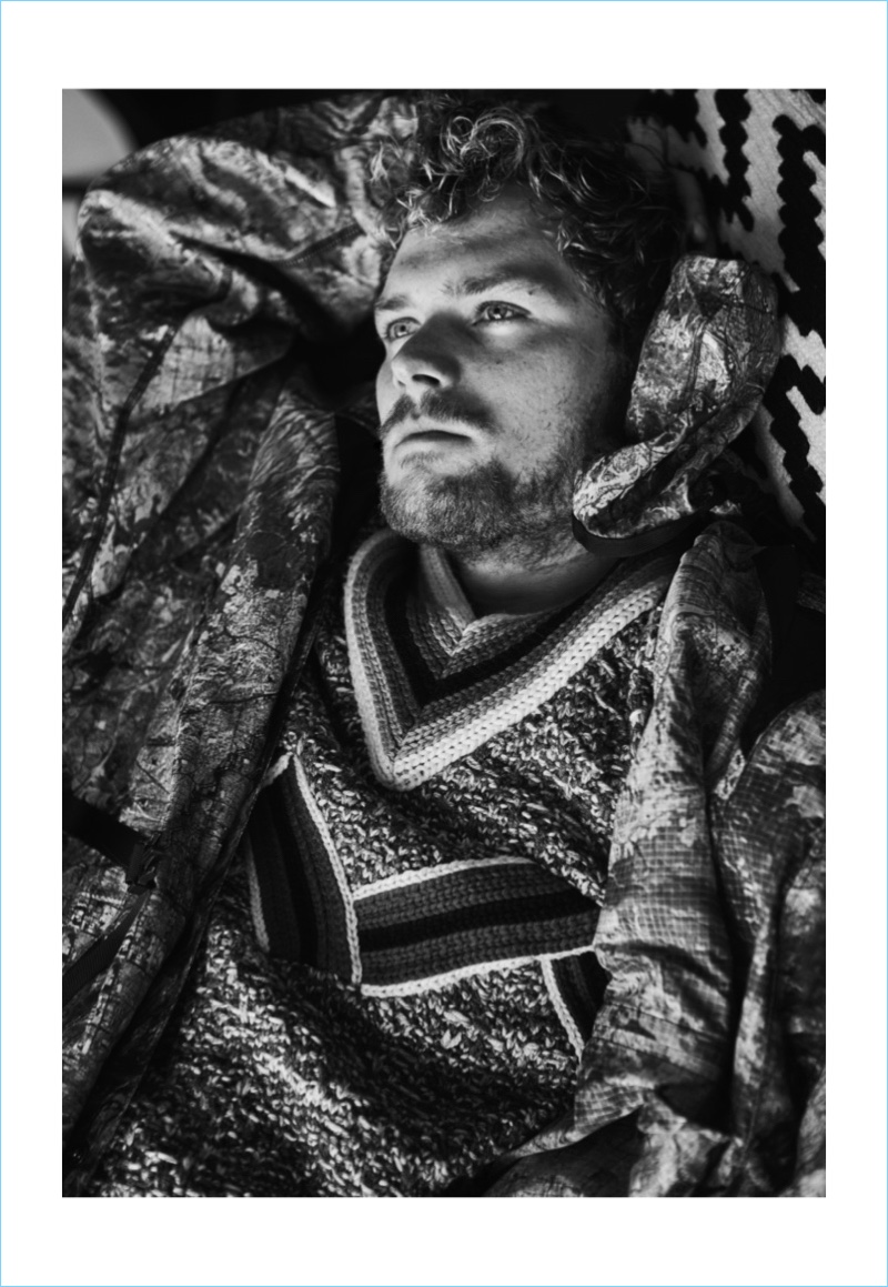 David Needleman photographs Finn Jones in a sweater and coat by Prada.