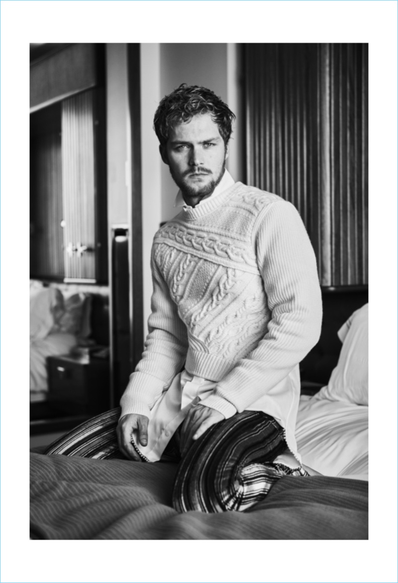 Joshua Liebman outfits Finn Jones in a sweater and shirt by Burberry with Roberto Cavalli striped pants.