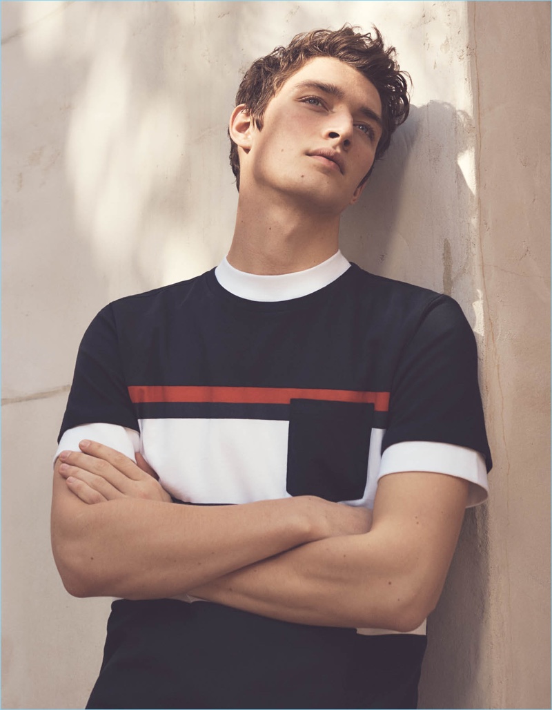 Otto Lotz wears a H&M color blocked pocket tee $14.99.