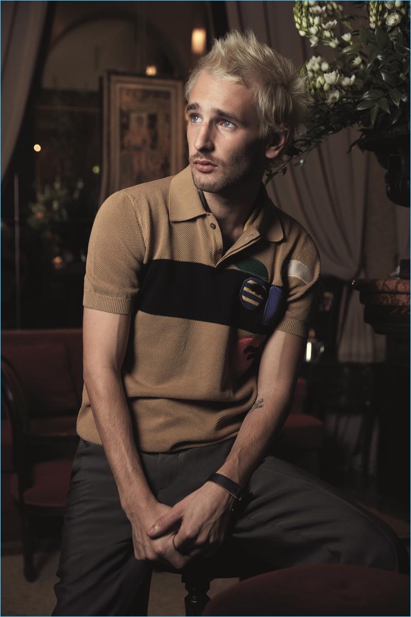 Connecting with Fendi, Hopper Penn wears a beige and black cotton polo shirt $750.