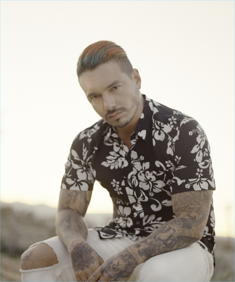 J Balvin fronts Ovadia & Sons' spring-summer 2017 campaign. The singer wears a floral short-sleeve shirt $245 and white slim-fit distressed jeans $250.