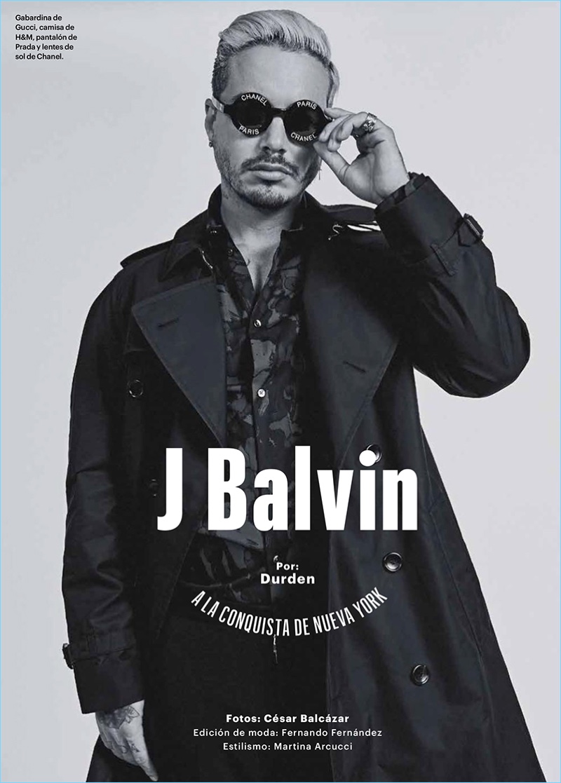 Music artist J. Balvin wears a Gucci trench coat with a H&M shirt, Prada trousers, and Chanel sunglasses.