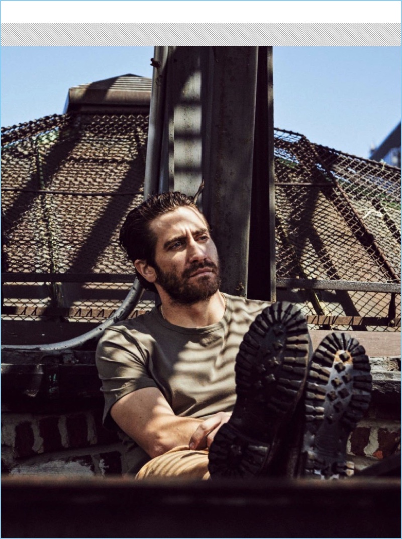 Relaxing, Jake Gyllenhaal sports a BOSS by Hugo Boss t-shirt with Carhartt WIP chinos and vintage boots.
