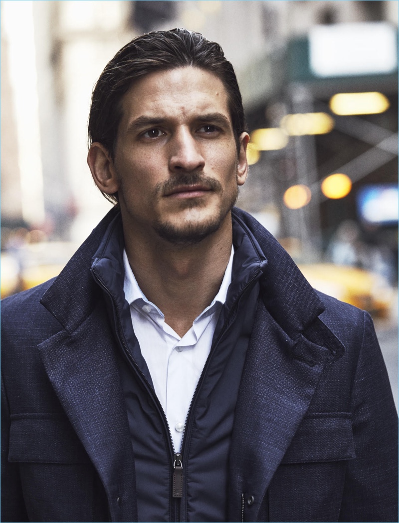 Australian model Jarrod Scott dons a navy Canali jacket with a Tommy Hilfiger shirt.