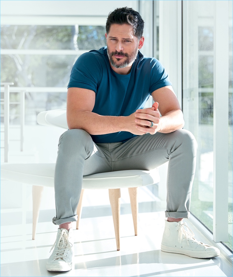 Actor Joe Manganiello wears a COS t-shirt with Bottega Veneta jeans, and Converse high-top sneakers.