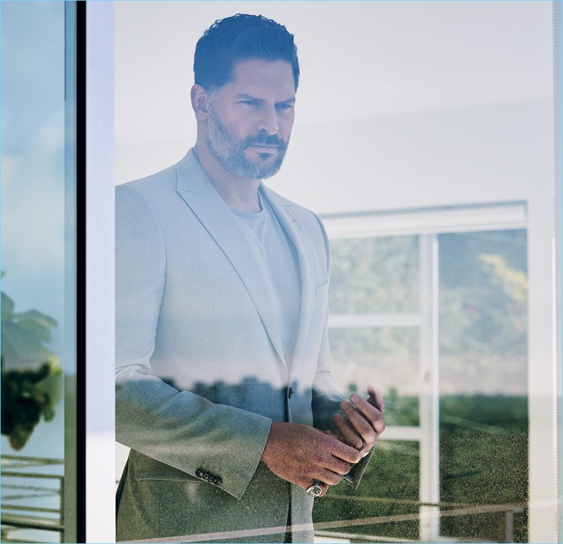 Embracing a sleek look, Joe Manganiello wears a Joseph Abboud suit with a COS t-shirt. » Joe Manganiello Covers Ocean Drive, Talks Physique Maintenance Embracing a sleek look, Joe Manganiello wears a Joseph Abboud suit with a COS t-shirt.