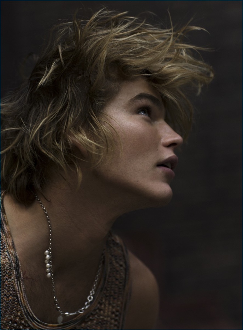 Delivering a side profile, Jordan Barrett wears a Missoni vest.