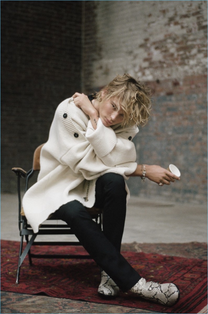 Australian model Jordan Barrett sports an oversized poncho by Raf Simons.