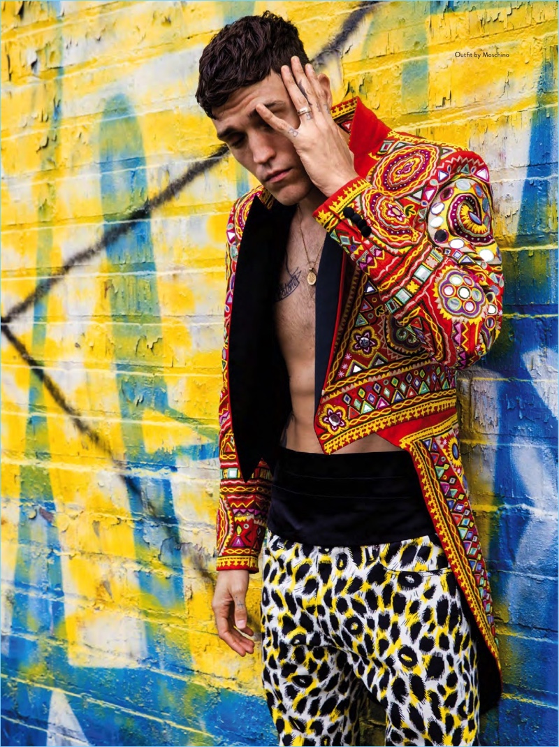 Embracing bold eccentric style, Josh Beech wears a spring look by Moschino.
