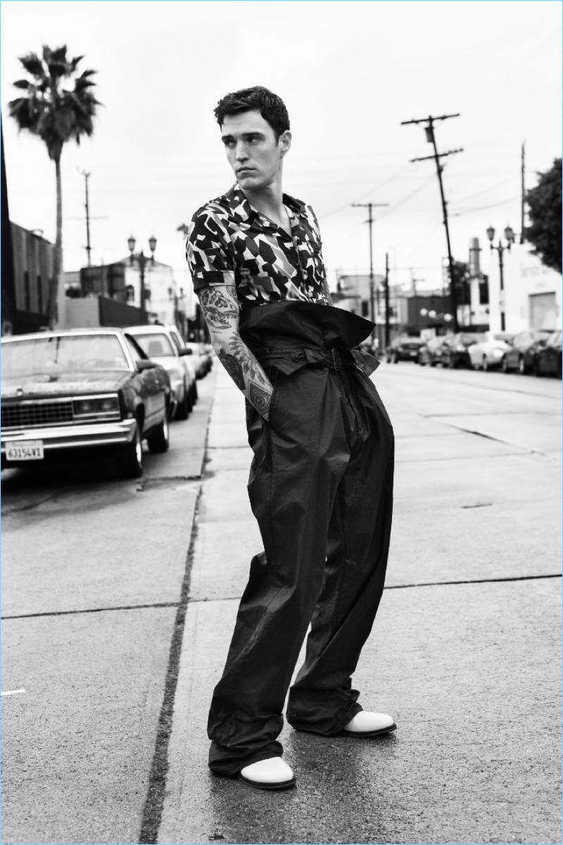 Appearing in a black and white photo, Josh Beech wears a spring look by Bottega Veneta.