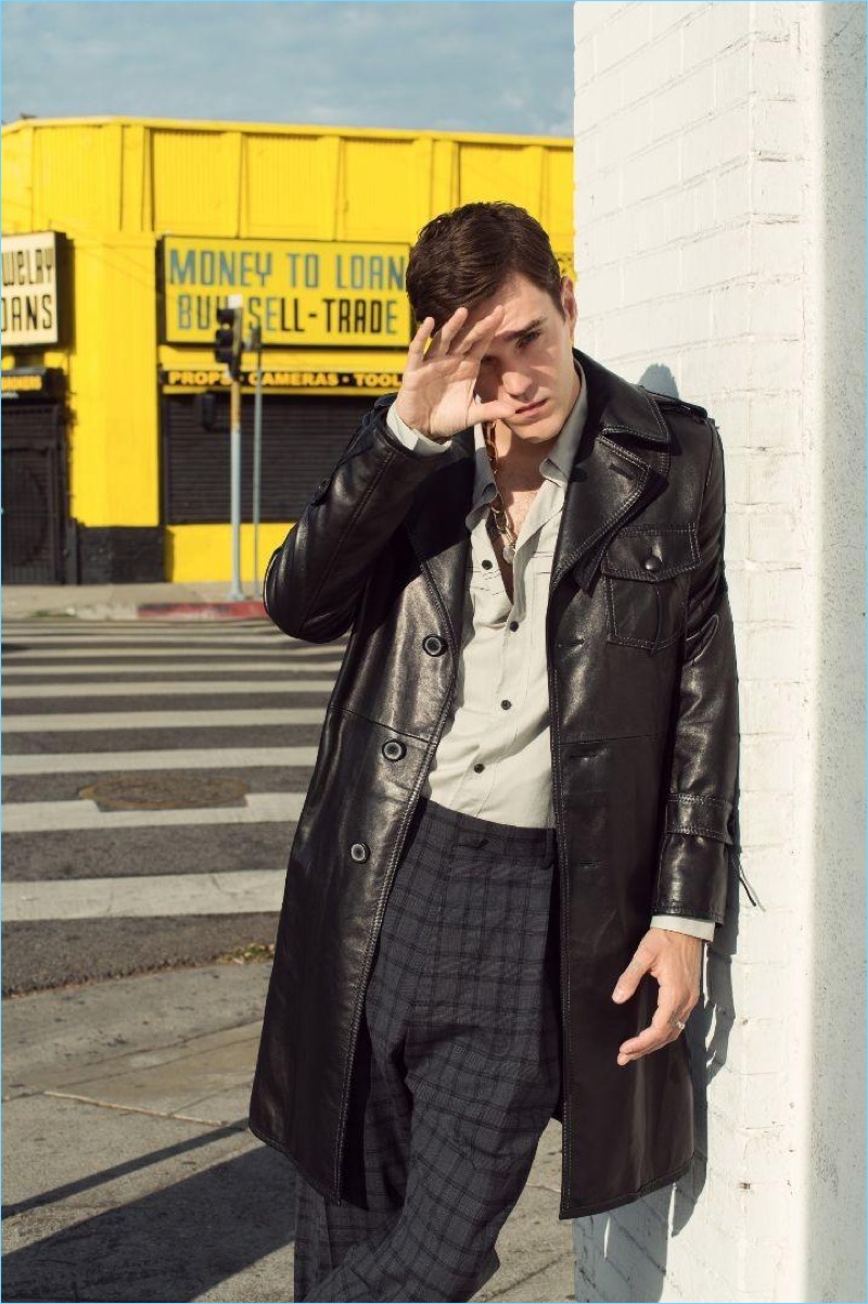 Sporting a leather coat and tailored separates, Josh Beech wears brands Lanvin and Valentino.
