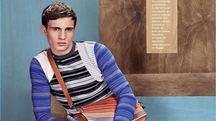 Embracing stripes, Julian Schneyder wears a sweater and pants by Loewe with Hogan shoes.