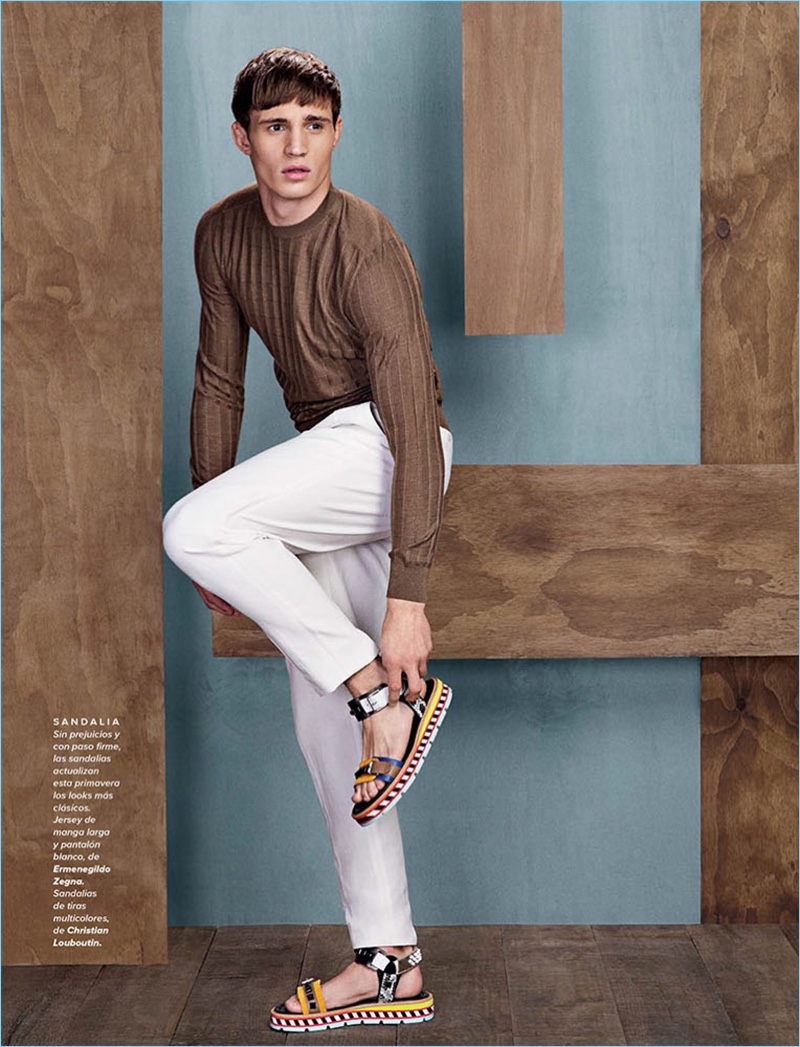 Top model Julian Schneyder wears an Ermenegildo Zegna sweater and pants with Christian Louboutin sandals.