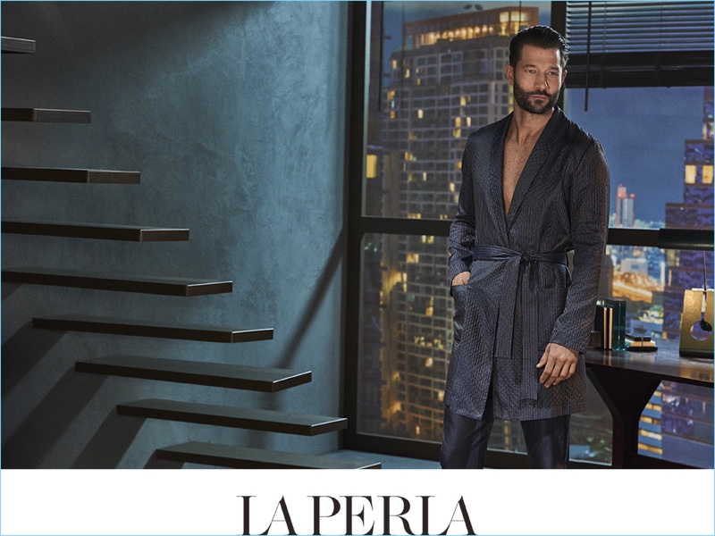 Lounging, John Halls wears a silk night robe and pajama pants for La Perla's spring-summer 2017 campaign.