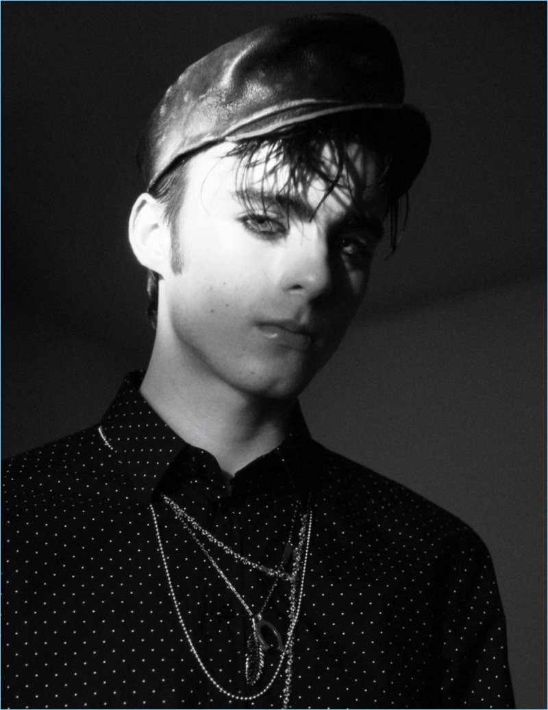 Model Lennon Gallagher sports a Dolce & Gabbana shirt with a Costume Studio leather cap.