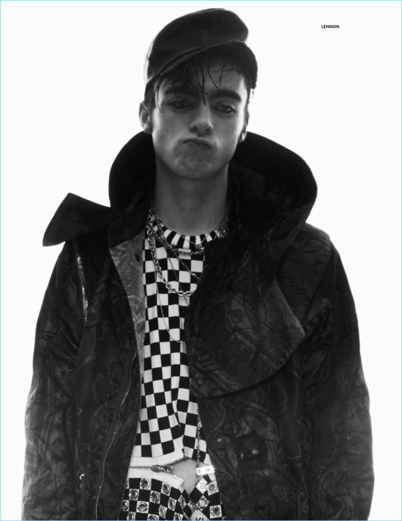 Pouring on the charm, Lennon Gallagher wears a Givenchy jacket and zippered top with a vintage leather cap from Costume Studio.