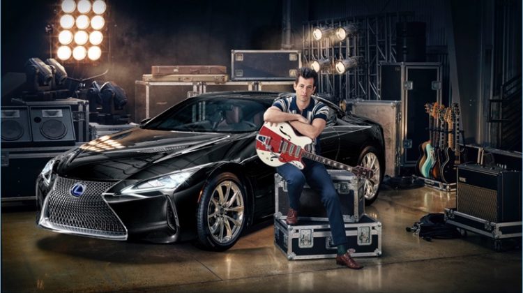 Posing with Lexus' LC coupe, Mark Ronson sports a retro-style polo shirt with slim-fit trousers.