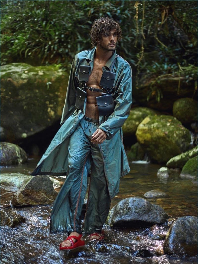 Clad in Prada, Marlon Teixeira accessorizes with a harness by Zana Bayne.