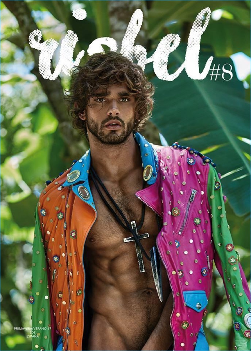 Marlon Teixeira covers Risbel magazine in a Moschino multi-colored leather biker jacket.