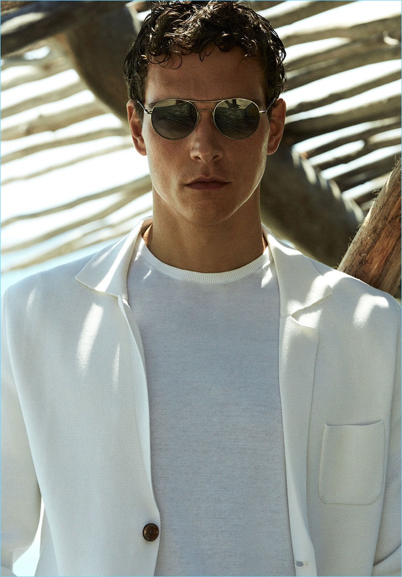 Alexandre Cunha dons a knit blazer and lightweight sweater from Massimo Dutti.