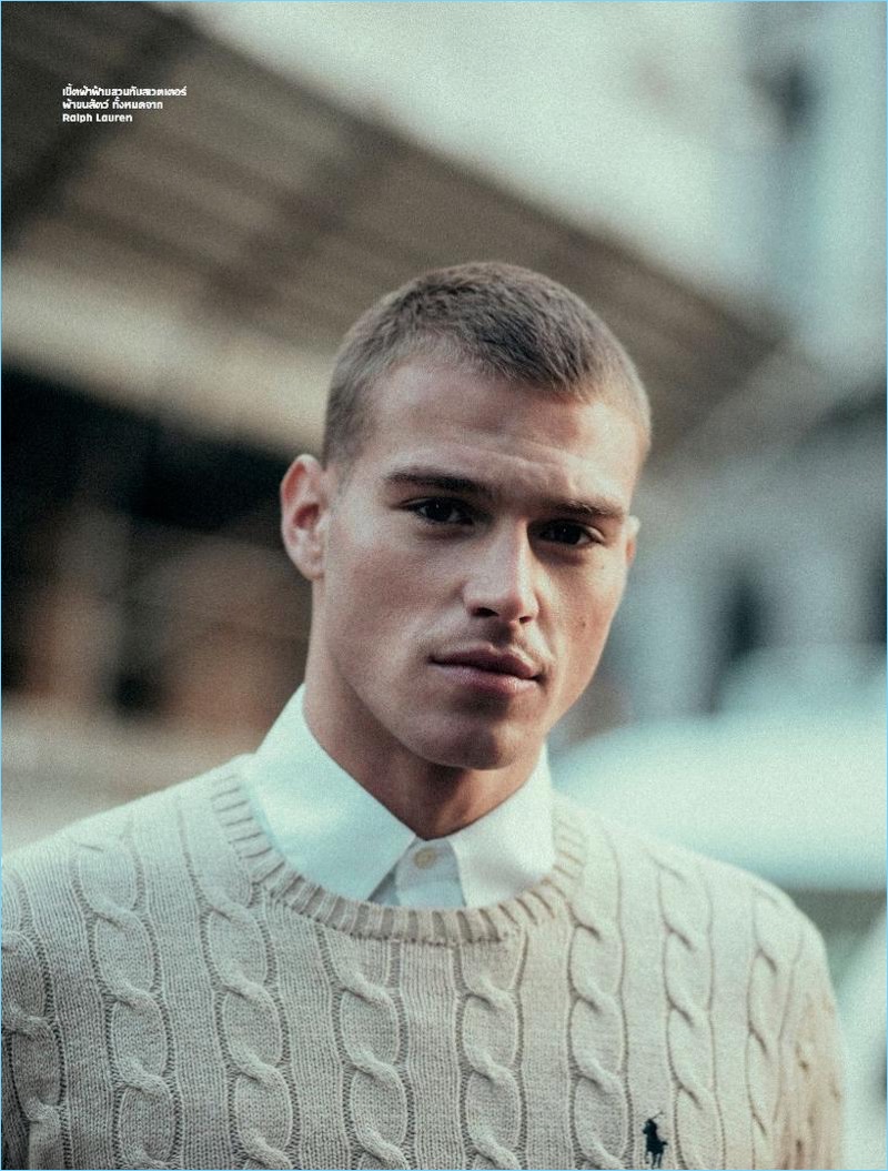 A preppy vision, Matthew Noszka wears a cable-knit sweater and shirt from Ralph Lauren.