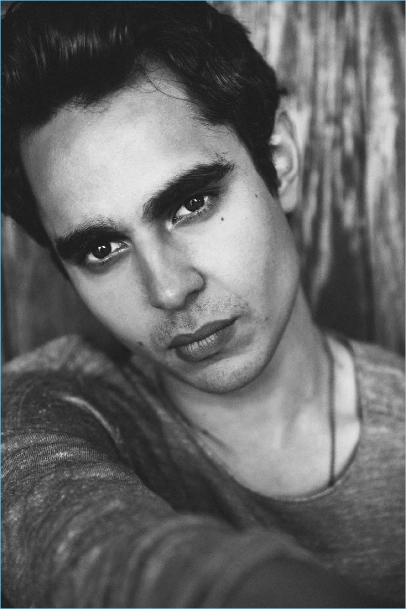 Actor Max Minghella wears a John Varvatos sweater with Canali trousers.