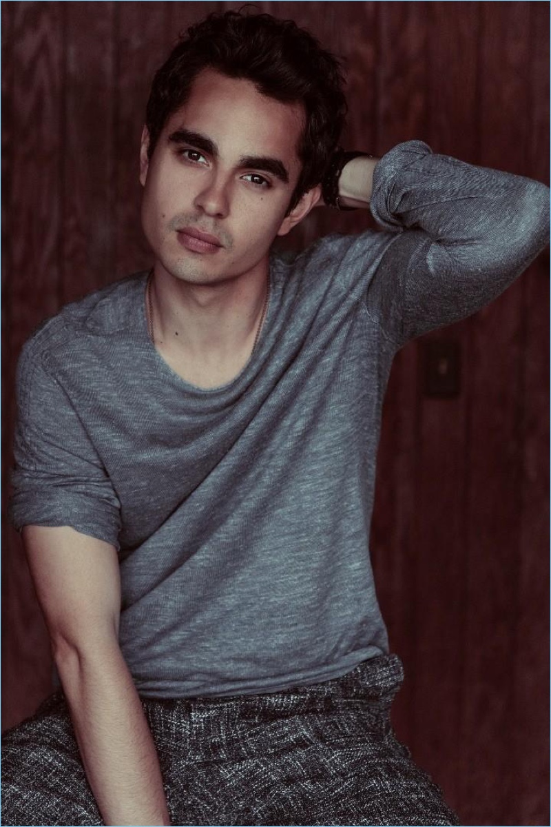 Front and center, Max Minghella wears a John Varvatos sweater with Canali trousers.