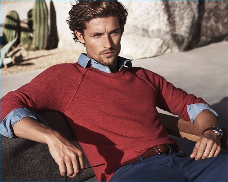 Lounging in a red sweater and navy chinos, Wouter Peelen fronts Michael Kors' spring-summer 2017 campaign.